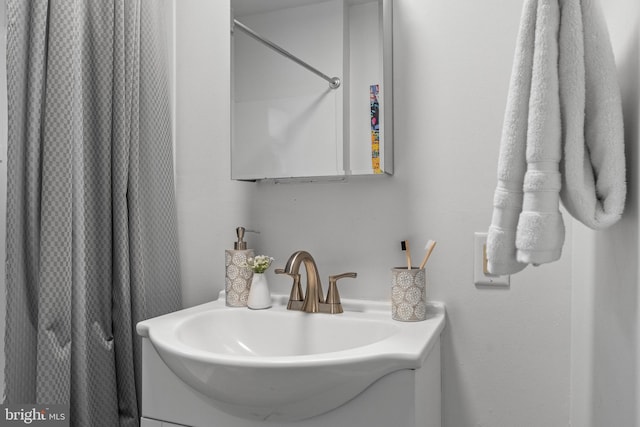 bathroom with vanity and walk in shower