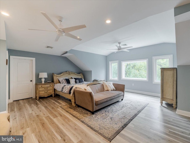 bedroom featuring light hardwood / wood-style flooring, lofted ceiling, and ceiling fan