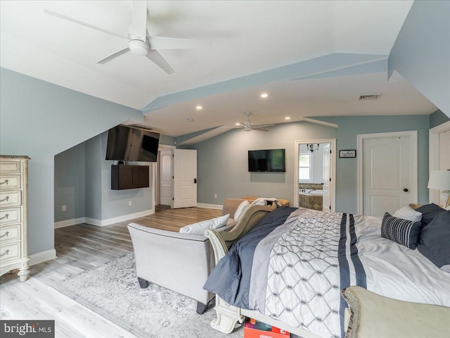 bedroom featuring ceiling fan, light wood-type flooring, and lofted ceiling