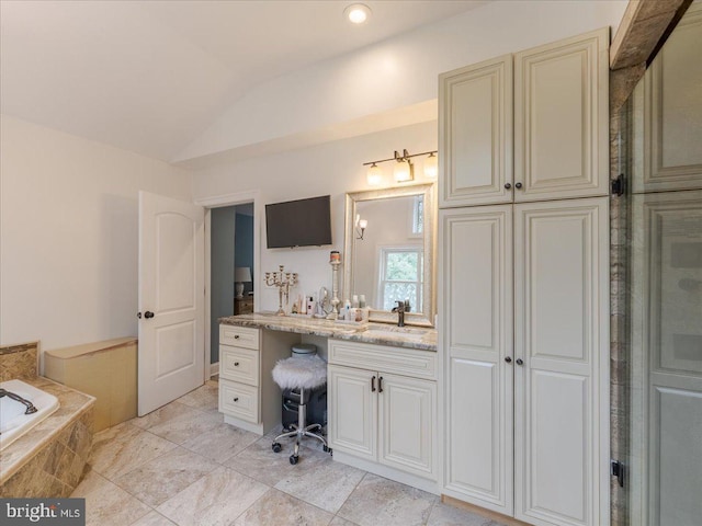 bathroom featuring lofted ceiling, an enclosed shower, a garden tub, and vanity