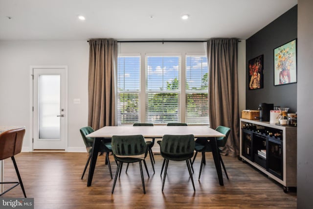 dining space featuring dark wood-type flooring