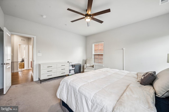 carpeted bedroom with ceiling fan