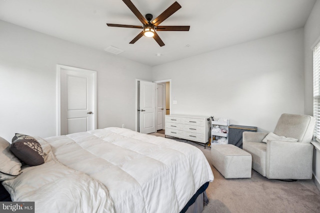 bedroom with light carpet and ceiling fan