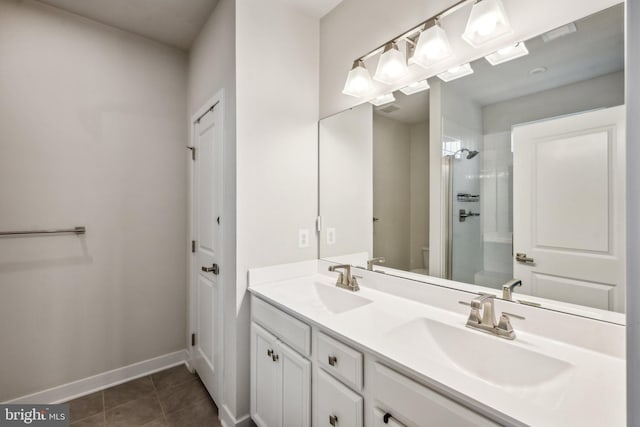 bathroom featuring tile patterned floors, walk in shower, vanity, and toilet