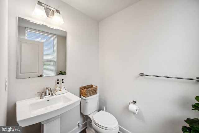 bathroom featuring sink and toilet