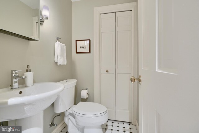 bathroom featuring toilet and tile patterned floors