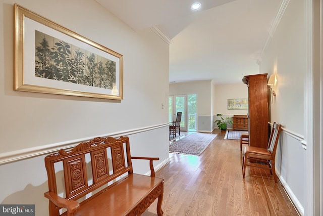 corridor with ornamental molding, recessed lighting, wood finished floors, and baseboards