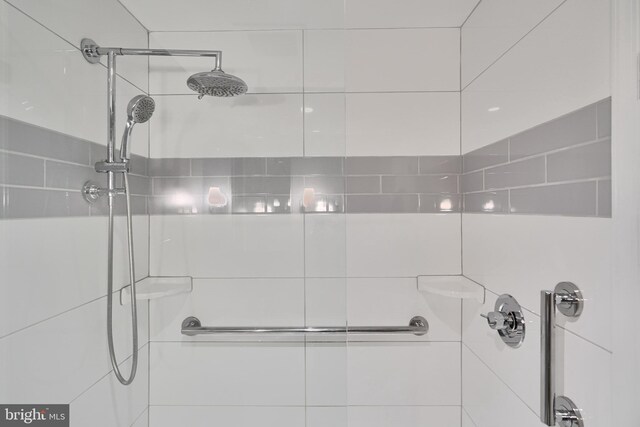 bathroom with tiled shower