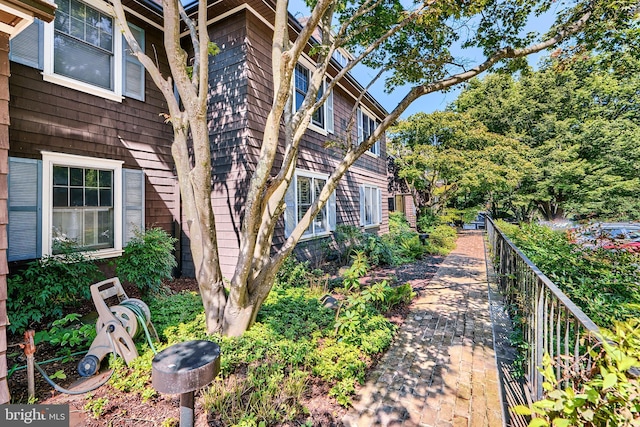 view of property exterior featuring fence