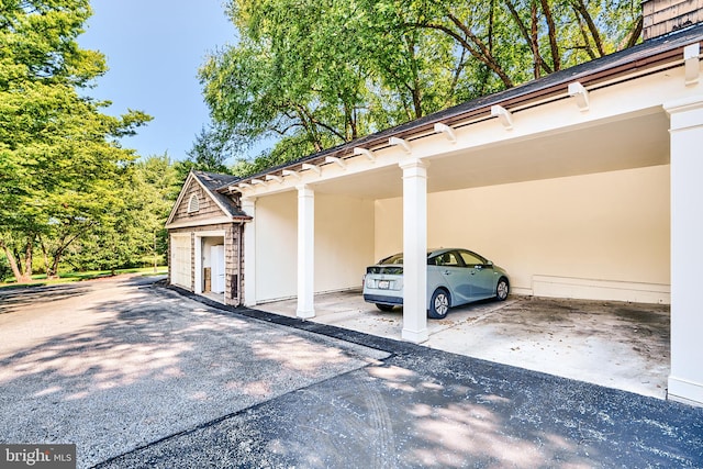 view of parking with a carport