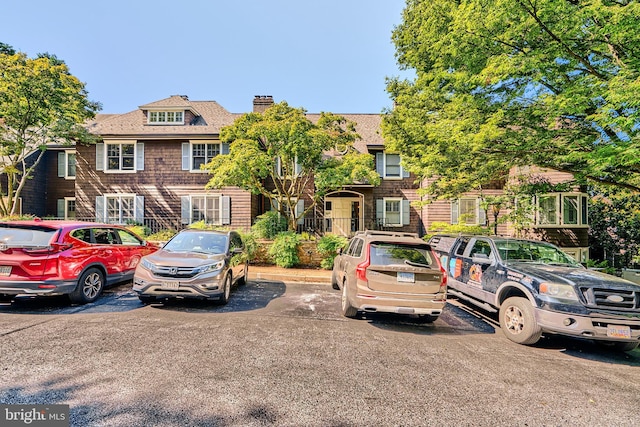 view of front of home featuring a chimney