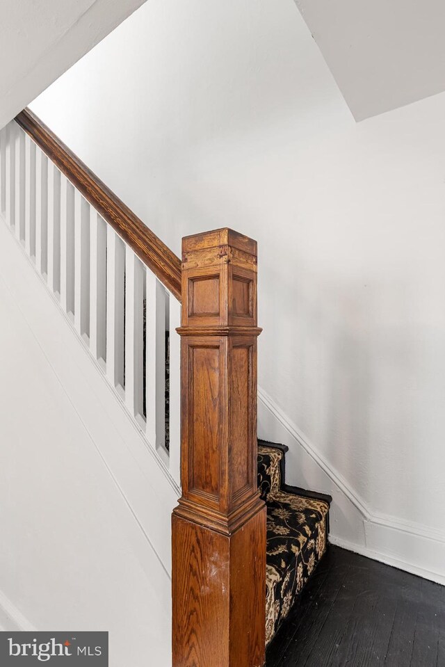 stairs with hardwood / wood-style floors