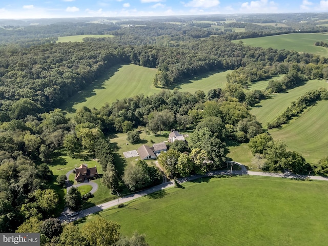 bird's eye view featuring a rural view and a forest view