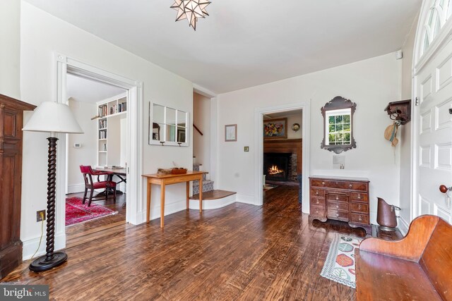 sitting room with dark hardwood / wood-style floors