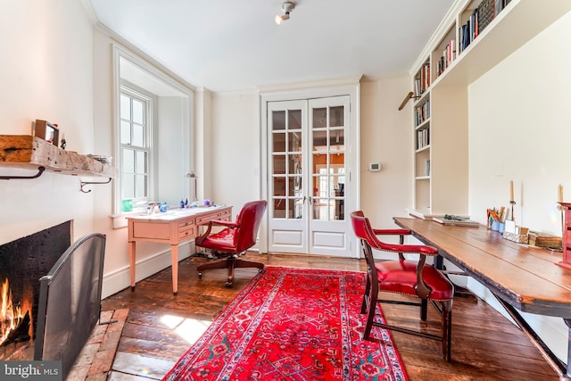 office space with ornamental molding, wood finished floors, and french doors
