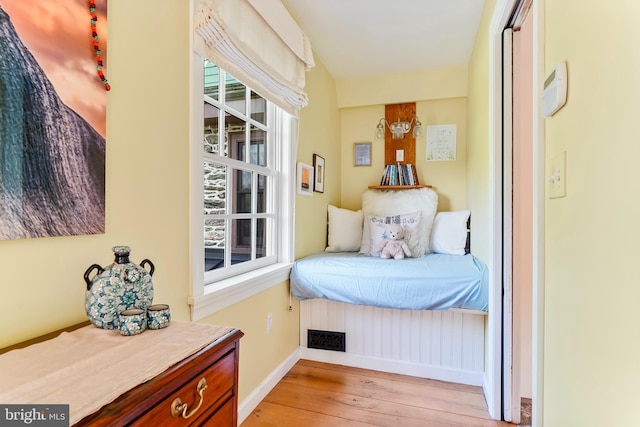 bedroom with baseboards and light wood-style floors