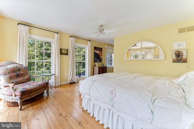 bedroom featuring ceiling fan and light hardwood / wood-style flooring