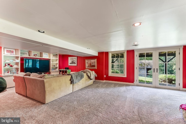 carpeted living area with recessed lighting