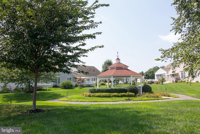 view of community featuring a lawn and a gazebo