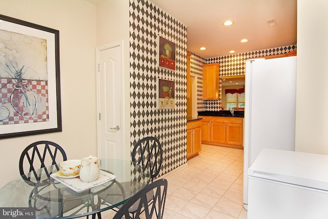 dining space featuring recessed lighting