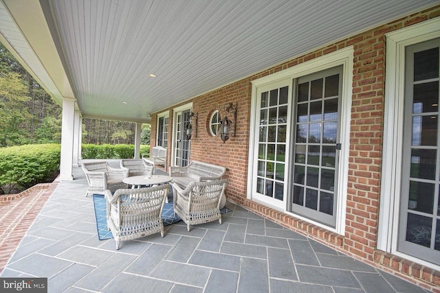 view of patio featuring a porch