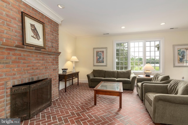 living room featuring a brick fireplace and ornamental molding