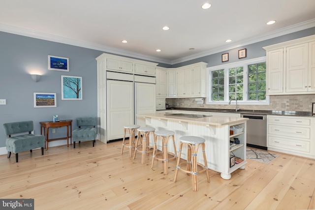 kitchen with white cabinetry, dishwasher, paneled refrigerator, backsplash, and a kitchen island