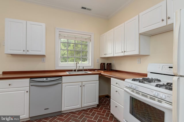 kitchen with white cabinetry, sink, white appliances, and ornamental molding