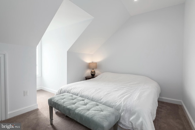 carpeted bedroom featuring lofted ceiling