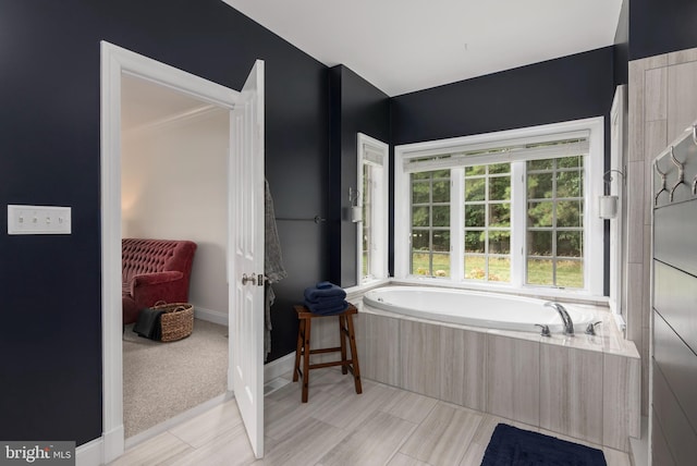 bathroom featuring a relaxing tiled tub