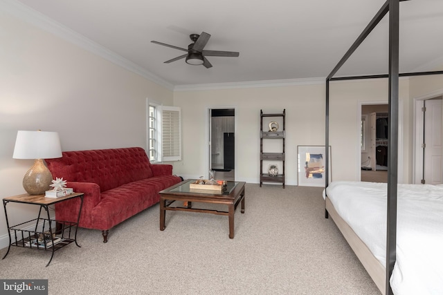 carpeted bedroom with ceiling fan and ornamental molding