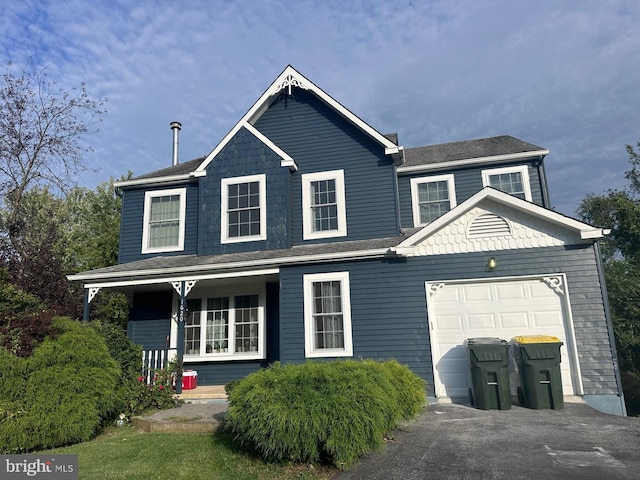 view of front of house with a garage and covered porch