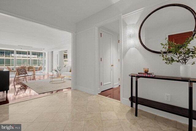 foyer entrance featuring light tile patterned floors