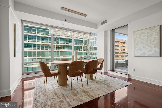 dining room featuring dark hardwood / wood-style flooring