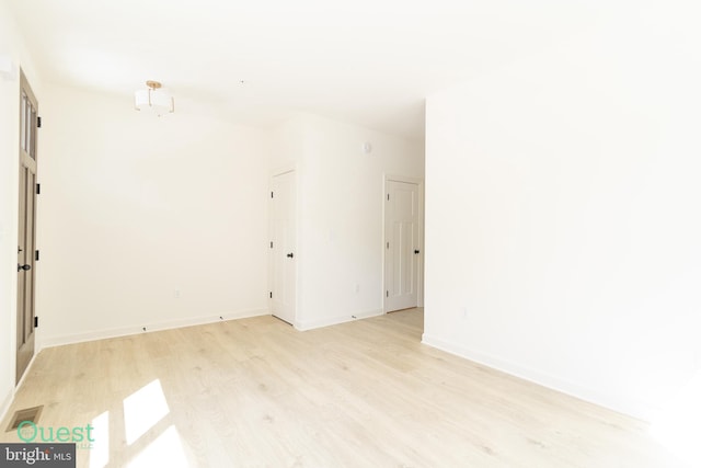 unfurnished room with light hardwood / wood-style floors