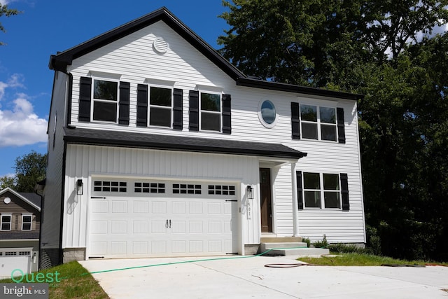 traditional-style house with driveway and a garage