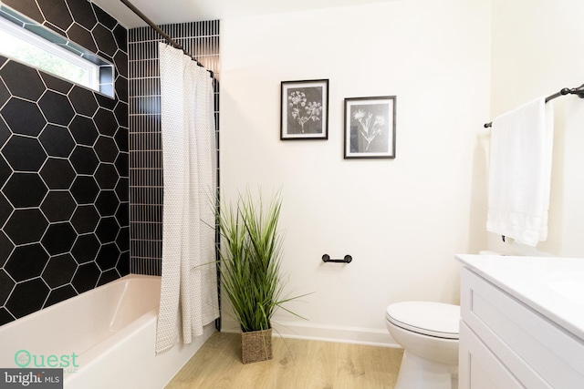 full bathroom with vanity, toilet, wood-type flooring, and shower / bath combo