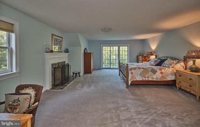 carpeted bedroom with access to exterior