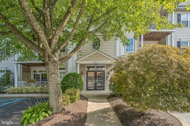 view of exterior entry featuring french doors