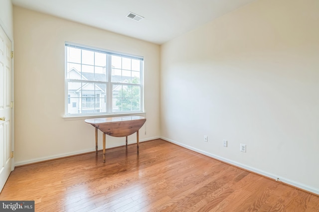 unfurnished room featuring light hardwood / wood-style floors