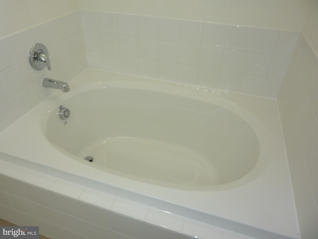 full bath with a garden tub