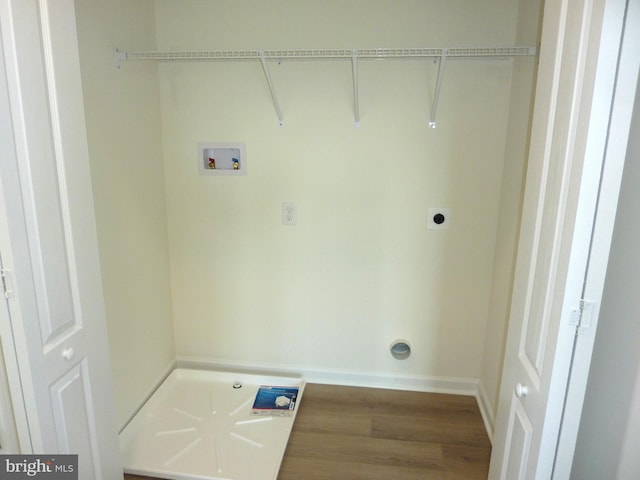 laundry room featuring washer hookup, hookup for an electric dryer, wood finished floors, laundry area, and baseboards