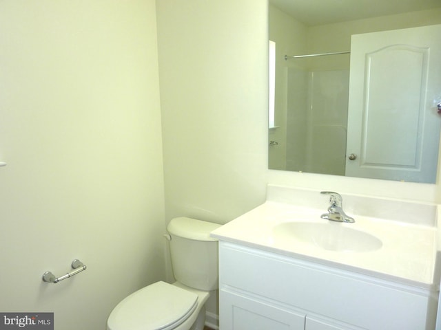 bathroom with toilet and vanity