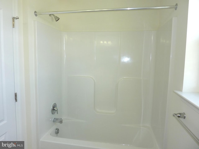 bathroom featuring a tub to relax in and walk in shower