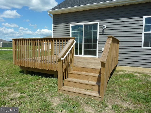 wooden deck with a yard