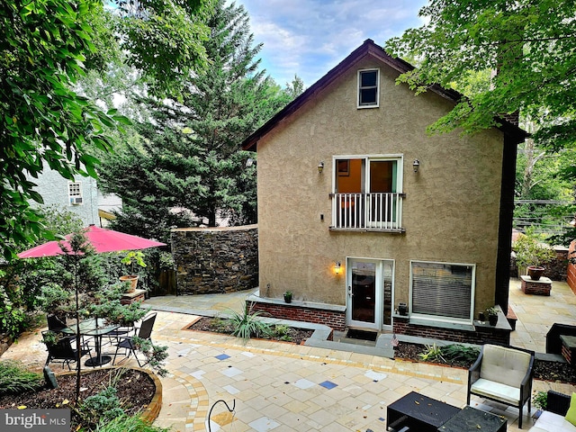 back of house featuring a patio