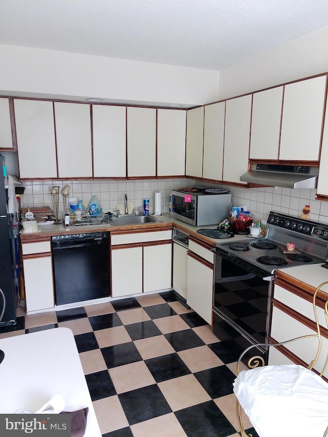 kitchen featuring white cabinetry, backsplash, sink, and black appliances