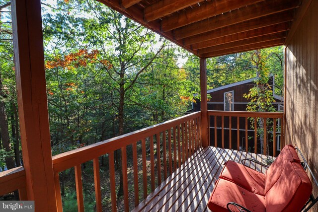 wooden balcony featuring a deck