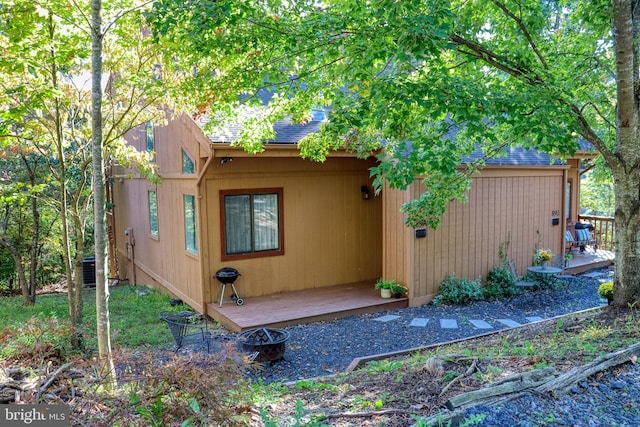 view of home's exterior featuring a wooden deck