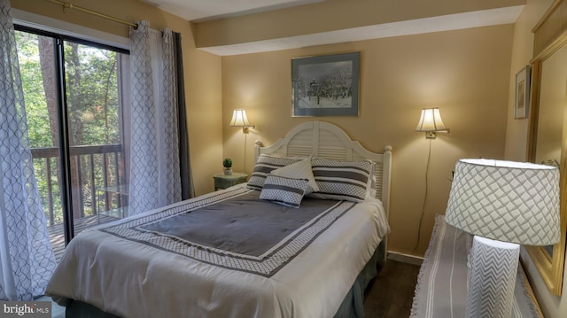 bedroom with dark hardwood / wood-style flooring